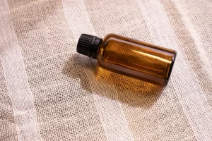 Mock-up amber glass bottles on natural background