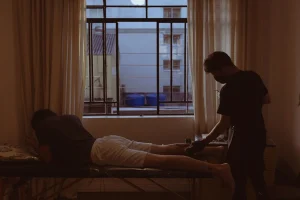 a man sitting on a bed